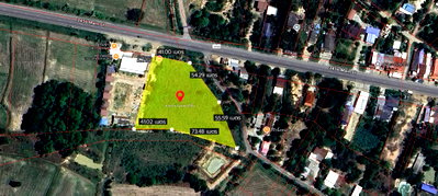 Land for sale Uthai Thani : Urgent sale! 4 rai of land with road access on 3 sides, 40 meters wide, located on a main road in a pink city plan. A rare corner plot