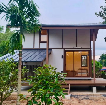 Prefabricated modular homes for sale. Loft style, balcony, and includes a pet house. Construction services available nationwide.